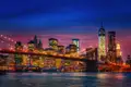 Die Skyline von New York in der Nacht mit der Brooklyn Bridge ist immer wieder faszinierend