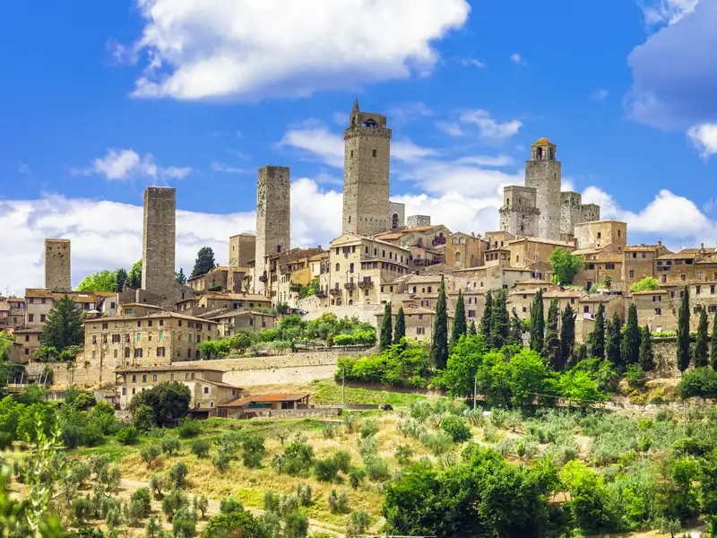 San Gimignano, ein Höhepunkt im doppelten Wortsinn auf unserer Wanderreise durch die Toskana. Die hoch aufragenden Geschlechtertürme zeugen vom Stolz der Erbauerfamilien.
